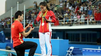 In twist, Chinese divers get engaged on Olympic medal stage 