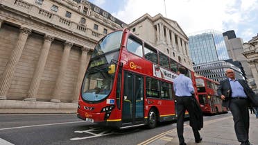 Bus driving past citizens and Bank of England AP