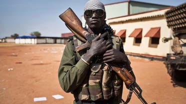 soldier stands outside headquarters in sudan. (AP)