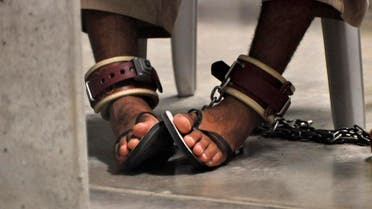 In this photo, reviewed by a U.S. Department of Defense official, a Guantanamo detainee's feet are shackled to the floor as he attends a 'Life Skills' class inside the Camp 6 high-security detention facility at Guantanamo Bay U.S. Naval Base April 27, 2010. (Reuters)
