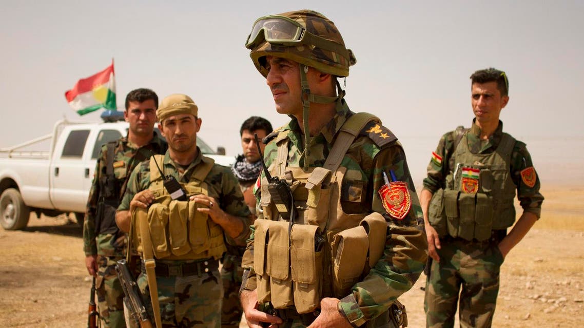 Lt. Col. Arshad Hussein with the 1st Zerevani Brigade at a small outpost outside the village of Qarqashah, Iraq. (AP)