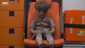‘Boy in ambulance’ becomes face of Aleppo strikes