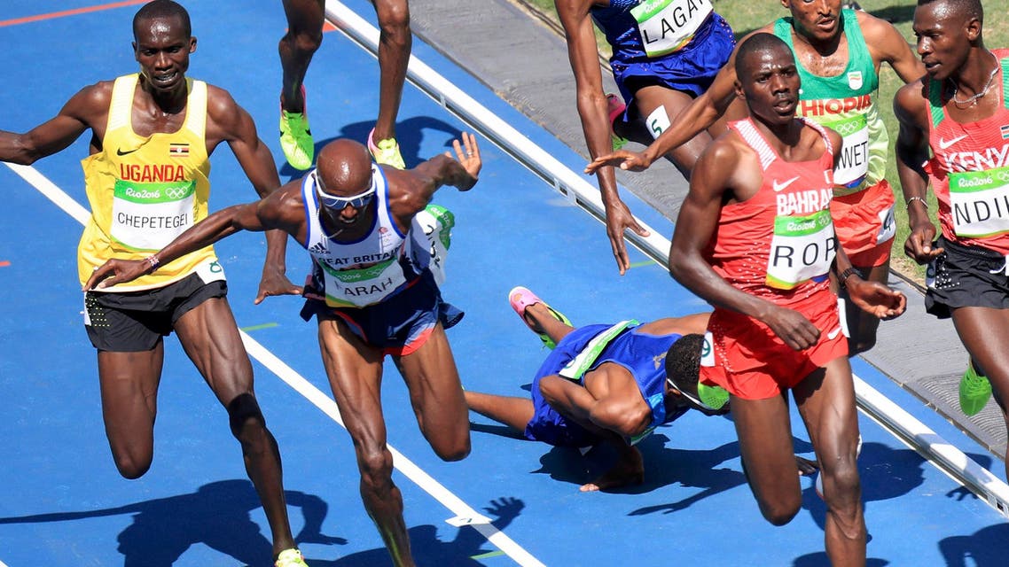 Mo farah runs as mead hassan of USA falls after they nearly collided. (Reuters)