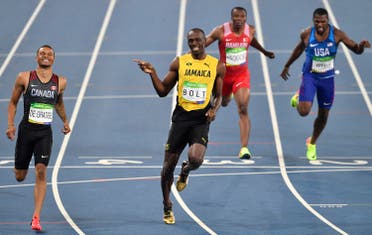 Jamaica’s Usain Bolt, center left, and Canada’s Andre De Grasse, left, compete in a men’s 200-meter semifinal 