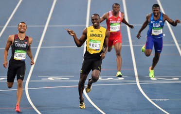 Jamaica’s Usain Bolt, center left, and Canada’s Andre De Grasse, left, compete in a men’s 200-meter semifinal