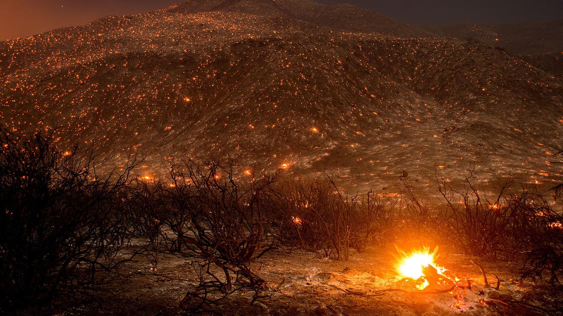 Embers from a wildfire smolder along Lytle Creek Road near Keenbrook, Calif., on Wednesday, Aug. 17, 2016. Firefighters had at least established a foothold of control of the blaze the day after it broke out for unknown reasons in the Cajon Pass near Interstate 15, the vital artery between Los Angeles and Las Vegas. (AP)