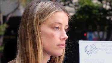 Actress Amber Heard leaves Los Angeles Superior Court on Friday, May 27, 2016, after giving a sworn declaration that her husband Johnny Depp threw her cellphone at her during a fight Saturday, striking her cheek and eye. (AP)