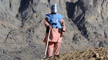 An Afghan de-mining security personnel looks on during an operation to clear mines from a field in the Panjwai district of Kandahar province on February 21, 2016. (AFP)