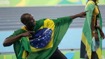 Unbeatable Bolt signs off with triple-triple