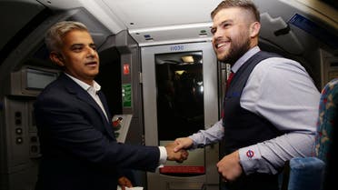 Mayor of London Sadiq Khan (left) with Daniel George, driver of the first Night Tube, in the drivers carriage of a Victoria line tube train at Brixton Underground station during the launch of London's Night Tube. (Reuters)