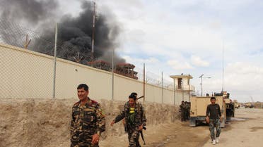 smoke rises from a building, where Taliban insurgents hide during a fire fight with Afghan security forces, in Helmand province, south west Afghanistan. (File photo: AP)