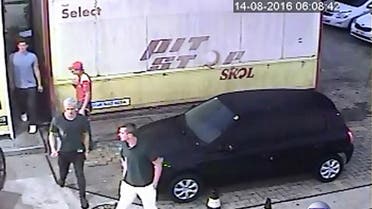 Security video shows three U.S. Olympic swimmers returning from a bathroom to their taxi at a gasoline station where they were accused by staff of having caused damage, in Rio de Janeiro, August 14, 2016.
