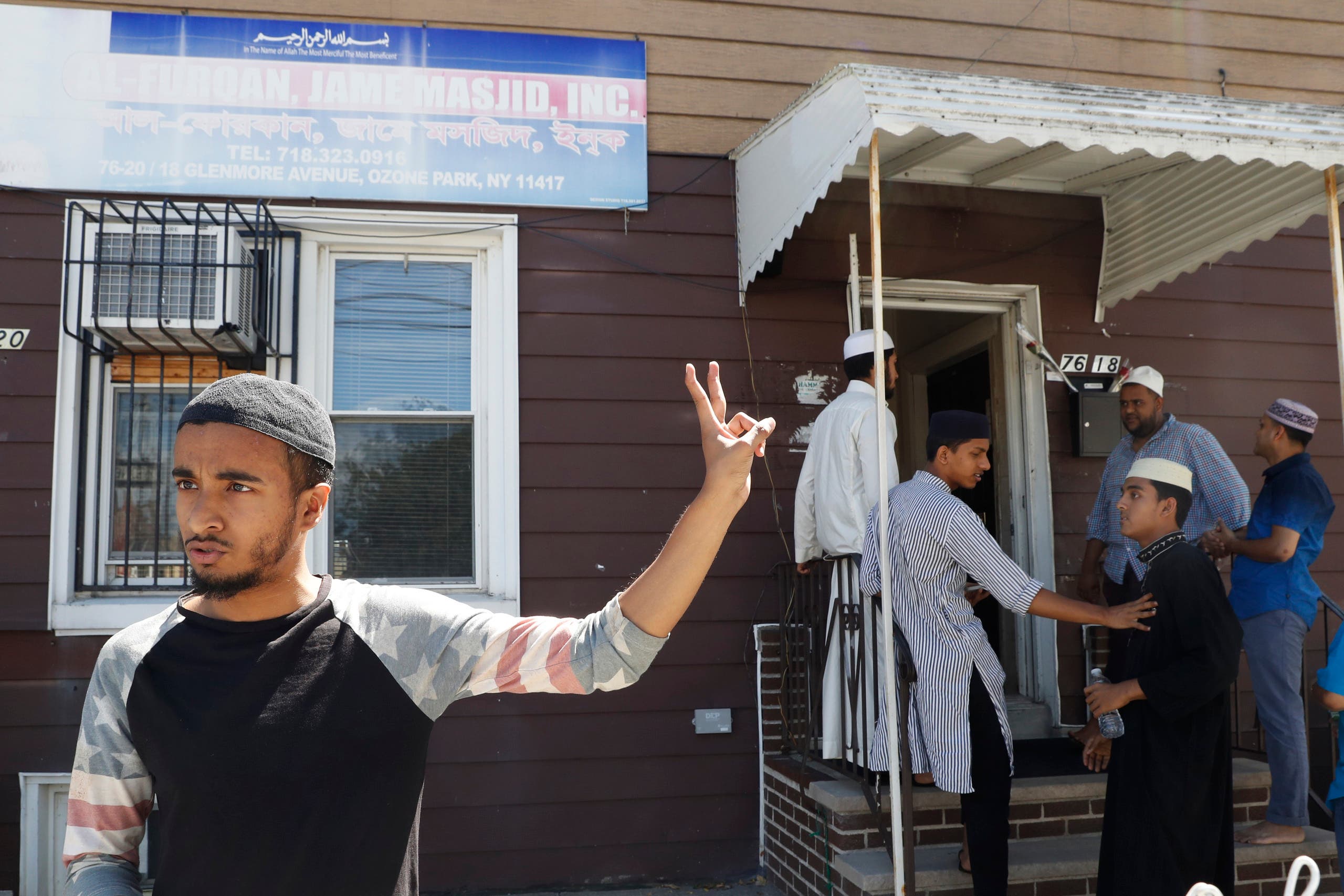 In this Wednesday, Aug. 17, 2016, photo Ashik Uddin gestures as he speaks during an interview with The Associated Press outside the Al-Furqan Jame mosque in the Ozone Park neighborhood of the Queens borough of New York. The shooting of an imam and his assistant near their New York mosque has unnerved Muslim residents of the Ozone Park section of Queens. (AP)