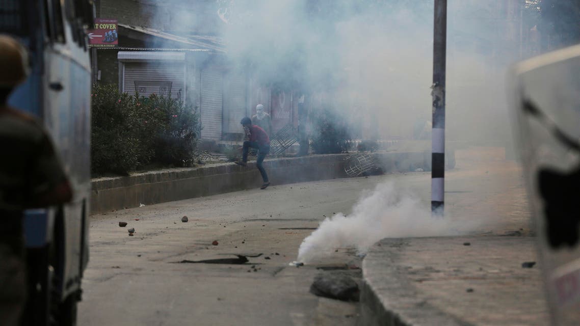 A Kashmiri protester runs for cover as a tear gas shell explodes near him in Srinagar, Indian controlled Kashmir, Sunday, Aug. 21, 2016. Security lockdown and protest strikes continued for the 44th straight day Sunday, with tens of thousands of Indian armed police and paramilitary soldiers patrolling the tense region. The killing of a popular rebel commander on July 8 sparked some of Kashmir's largest protests against Indian rule in recent years. (Photo: AP))