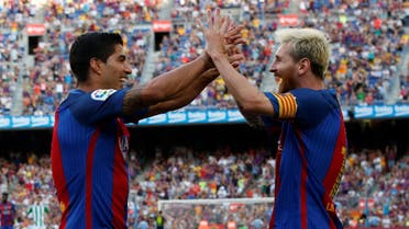 Barcelona's Luis Suarez and Lionel Messi celebrate a goal against Real Betis. REUTERS