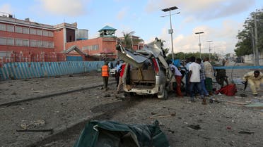 Somali police and civilians search for people wounded in a blast outside a hotel in Somalia's capital Mogadishu, November 1, 2015. Two bombs ripped into a hotel in the Somali capital on Sunday and security forces fought Islamist al Shabaab gunmen who stormed inside the building for hours afterwards, police and witnesses said. At least 11 people were killed. Al Shabaab, which has frequently launched attacks in Mogadishu in its bid to topple the Western-backed government, said it was behind the assault on the Sahafi hotel where government officials and lawmakers stay. REUTERS