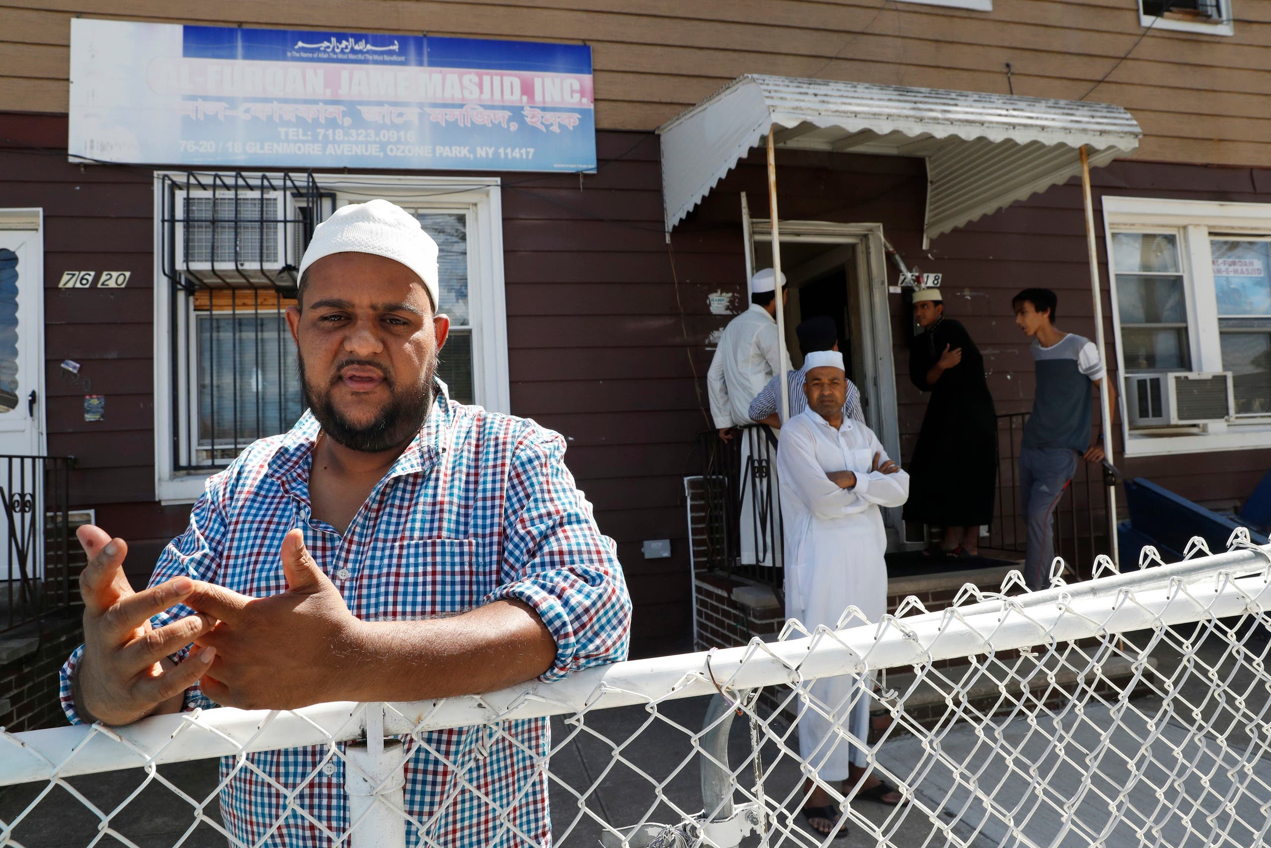 In this Wednesday, Aug. 17, 2016, photo Nurul Hoque gestures as he speaks during an interview with The Associated Press outside the Al-Furqan Jame mosque in the Ozone Park neighborhood of the Queens borough of New York. The shooting of an imam and his assistant near their New York mosque has unnerved Muslim residents of the Ozone Park section of Queens. (AP)