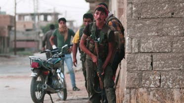 Kurdish fighters from the People's Protection Units (YPG) carry their weapons as they take positions in the northeastern city of Hasaka, Syria, August 20, 2016. Reuters
