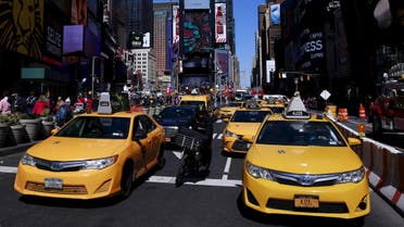 New York City taxi cabs drive through Times Square in New York March 29, 2016. REUTERS