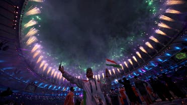 Participants celebrate as fireworks explode during the closing ceremony. (Reuters)