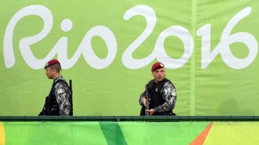Police officers watch during the men's Gold medal field hockey Belgium vs Argentina match of the Rio 2016 Olympics Games at the Olympic Hockey Centre in Rio de Janeiro on August 18, 2016. Pascal GUYOT / AFP