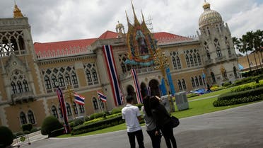 Thai reporters play Pokemon Go on their phone at a Government house in Bangkok, Thailand, Monday, Aug. 8, 2016. Two days after the highly anticipated Pokemon Go game was released in Thailand, officials have drawn up a list of places where Pokemon can't go. The royal palace is one of them. (AP)