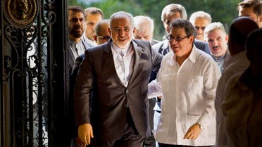 Iranian Foreign Minister Mohammad Javad Zarif, left, is welcomed by Cuban Foreign Minister Bruno Rodriguez, in Havana, Cuba. (AP)