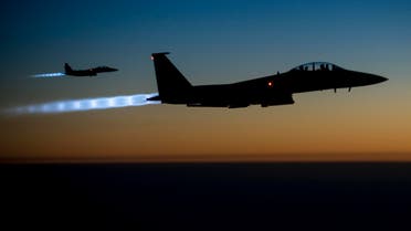A pair of U.S. Air Force F-15E Strike Eagles fly over northern Iraq after conducting airstrikes in Syria, in this U.S. Air Force handout photo taken early in the morning of September 23, 2014. Reuters