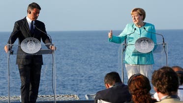 Italian Prime Minister Matteo Renzi, German Chancellor Angela Merkel (R) and French President Francois Hollande (not seen) lead a news conference on the Italian aircraft carrier Garibaldi off the coast of Ventotene island, central Italy, August 22, 2016. REUTERS
