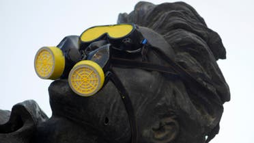 A gas mask is placed over a statue in Martyrs’ Square during a demonstration marking a year since the chemical attack in Syria's eastern Ghouta, in downtown Beirut August 21, 2014. (Reuters)