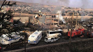 Smoke still rises from the scene after Kurdish militias attacked a police checkpoint in Cizre, southeast Turkey, Friday, Aug. 26, 2016, with an explosives-laden truck, killing many (Photo: DHA via AP)