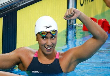 Jasmine al-Khaldi from the Philippines celebrates after winning the women's 100- meter freestyle during the 27th Southeast Asian (SEA) Games in Naypyitaw, Myanmar, Thursday, Dec. 12, 2013. (AP) 