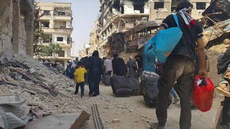 Fighters evacuated from besieged Syria town reach rebel city