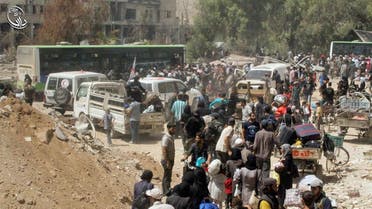 This photo provided by the Syrian anti-government activist group Local Council of Daraya City, which has been authenticated based on its contents and other AP reporting, shows Syrian citizens gather with their belonging as they prepare to evacuate from Daraya, a blockaded Damascus suburb, on Friday, Aug. 26, 2016. The development in the Daraya suburb is part of an agreement struck between the rebels and the government of President Bashar Assad. Rebels agreed to evacuate after four years of grueling bombardment and a crippling siege that has left the sprawling suburb southwest of the capital in ruins.(Local Council of Daraya City via AP)