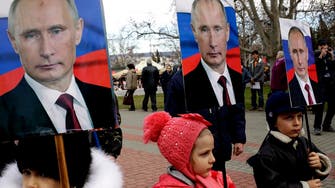 Putin re-writes Russian history as Ukraine celebrates a milestone