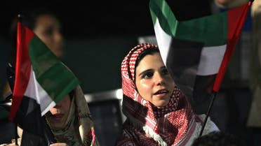 Emirati women wave their national flag AFP