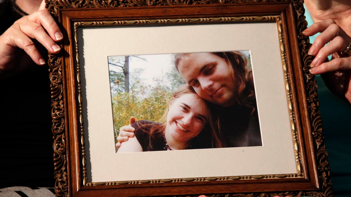 Mother’s Linda Boyle, left and Lyn Coleman hold photo of their married children, Joshua Boyle and Caitlan Coleman, who were kidnapped by the Taliban in late 2012, Wednesday, June 4, 2014. ap