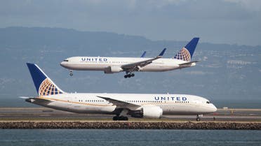A United Airlines Boeing 787 taxis as a United Airlines Boeing 767 lands at San Francisco International Airport, San Francisco, California, February 7, 2015. REUTERS
