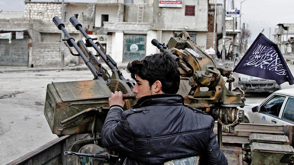 In this Friday February 8, 2013, photo, a Free Syrian Army fighter sits behind an anti-aircraft weapon in Aleppo, Syria. Syrian rebels brought their fight within a mile of the heart of Damascus on Friday, seizing army checkpoints and cutting a key highway with a row of burning tires as they pressed their campaign for the heavily guarded capital, considered the likely endgame in the nearly 2-year-old civil war. (AP)