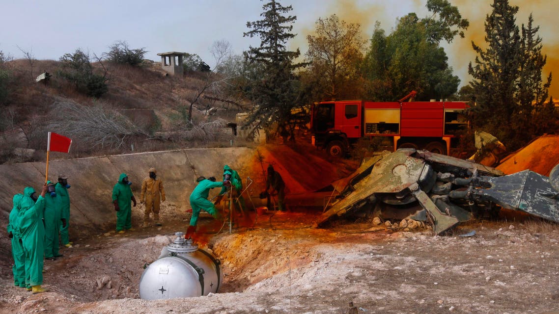 A team of Libyan experts and military engineers dump away fuel from expired SA-2 missiles, under the supervision of the United Nations, in Tripoli November 11, 2012. Experts were assigned to dump the toxic chemicals found in the air defense missiles left over from the former Gaddafi's regime. REUTERS