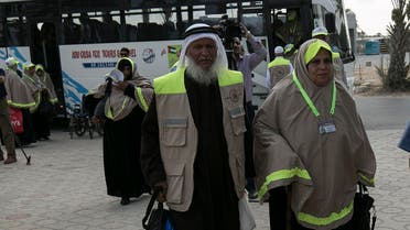 Palestinian Muslim pilgrims arrive at the Rafah border crossing between Egypt and the southern Gaza Strip, on August 30, 2016 ahead of their departure to the annual Hajj pilgrimage in Saudi Arabia's holy city of Mecca. SAID KHATIB / AFP