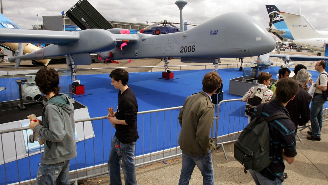  Visitors look at an Israel Aerospace Industries-made drone, Heron TP, on the last day of the 47th Paris Air Show in Le Bourget, north of Paris, Sunday June 24, 2007. The Heron TP is a medium altitude long endurance UAV system. (AP Photo/Remy de la Mauviniere)
