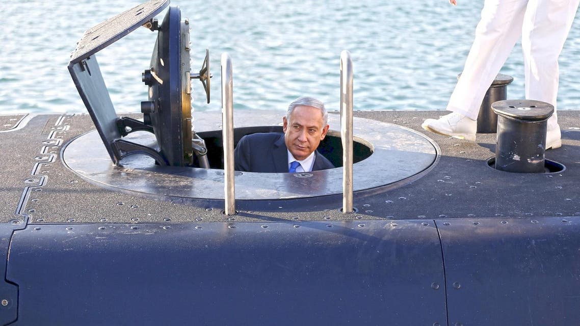 sraeli Prime Minister Benjamin Netanyahu climbs out after a visit inside the Rahav, the fifth submarine in the fleet, after it arrived in Haifa port January 12, 2016. (Reuters)
