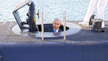 sraeli Prime Minister Benjamin Netanyahu climbs out after a visit inside the Rahav, the fifth submarine in the fleet, after it arrived in Haifa port January 12, 2016. (Reuters)