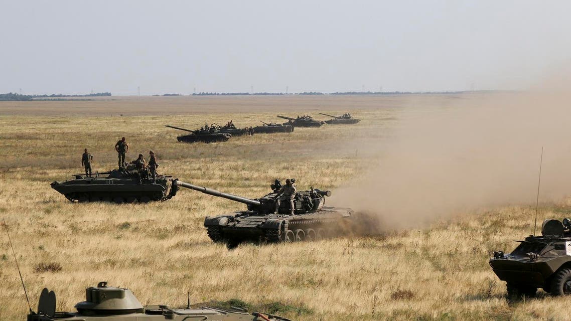 Ukrainian tanks and APCs move towards the de-facto border with Crimea near Kherson, southern Ukraine, Friday, Aug. 12, 2016. Ukraine put its troops on combat alert Thursday along the country's de-facto borders with Crimea and separatist rebels in the east amid an escalating war of words with Russia over Crimea. (AP Photo/Aleksandr Shulman)