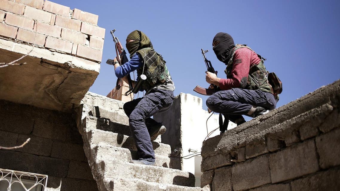 Militants from the Kurdistan Workers' Party, or PKK, run as they attack Turkish security forces in Nusaydin, Turkey, Tuesday, March 1, 2016. Turkish authorities say a curfew in the district of Cizre in the southeastern province of Sirnak will be lifted at 5 a.m. on Wednesday. The curfew was declared on Dec. 14, coupled with large-scale military operations to flush out Kurdish militants who set up ditches and trenches to keep security forces at bay.(AP Photo/Cagdas Erdogan)