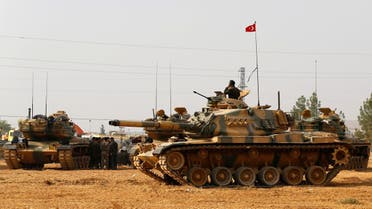 Turkish army tanks and military personal are stationed in Karkamis on the Turkish-Syrian border in the southeastern Gaziantep province, Turkey, August 25, 2016. reuters