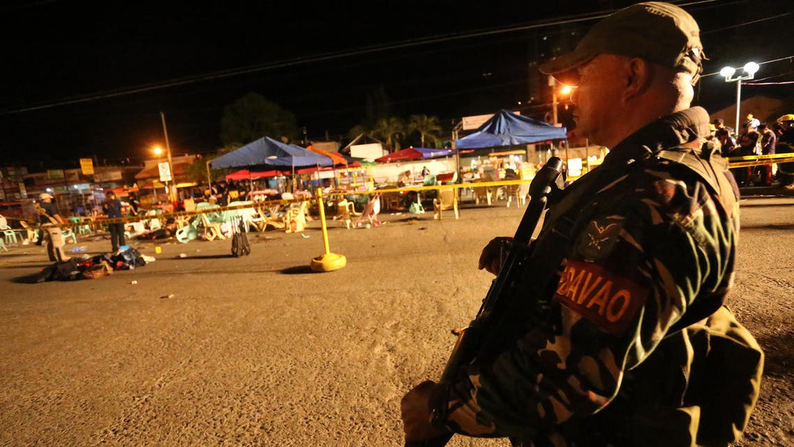 A Philippine soldier keeps watch at a blast site at a night market that has left several people dead and wounded others in southern Davao city, Philippines late Friday Sept. 2, 2016. (AP)