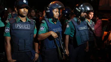Bangladeshi policemen keep vigil at the scene of a raid on a suspected militant hideout in Dhaka, Bangladesh, Friday, Sept. 2, 2016. (AP)