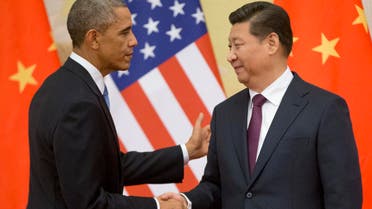 In this Nov. 12, 2014 file photo, President Barack Obama shakes hands with Chinese President Xi Jinping at the conclusion of their joint news conference at the Great Hall of the People in Beijing. (AP)